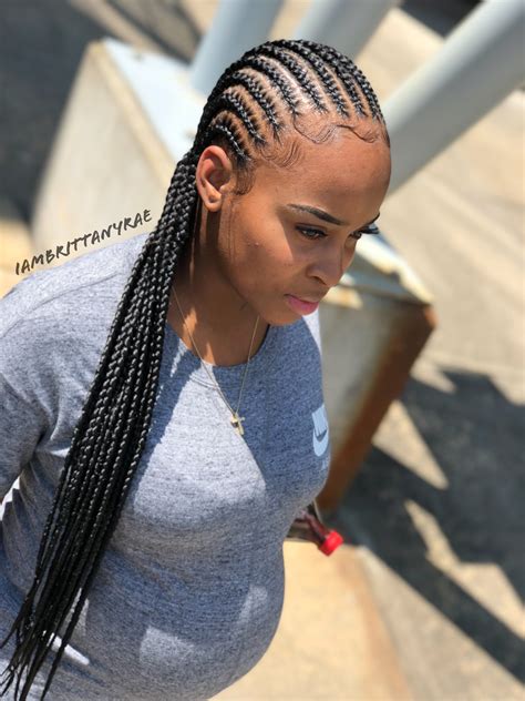 It also features two braids facing forward near the ears. . Straight back cornrows braids